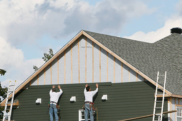 Professional Siding technician working in Bowie, TX